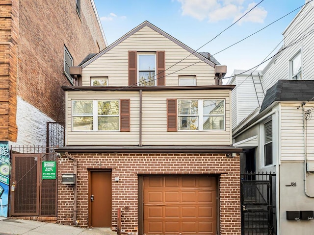 view of front of house with brick siding and an attached garage