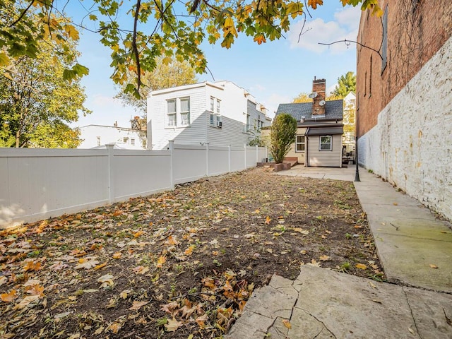 view of yard with a patio area and a fenced backyard