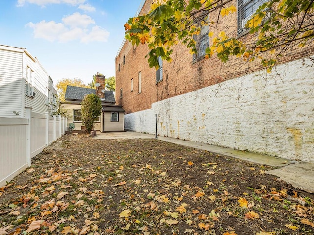 view of yard with a patio area and a fenced backyard