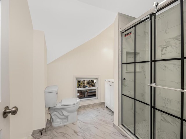 bathroom featuring a stall shower, toilet, marble finish floor, vaulted ceiling, and vanity