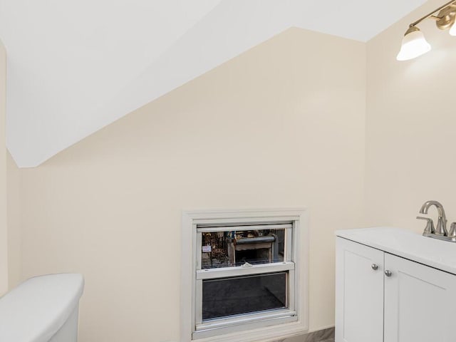 bathroom with toilet and vanity