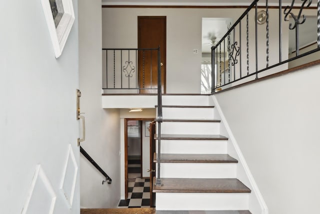 stairs with tile patterned floors