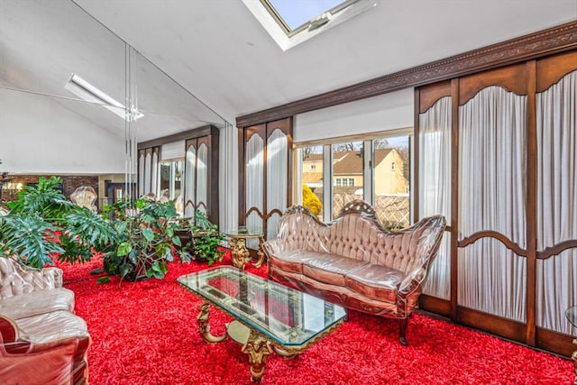 sunroom with vaulted ceiling with skylight