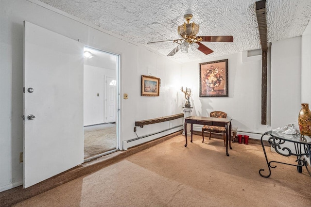 carpeted home office with a baseboard radiator, a ceiling fan, and a textured ceiling