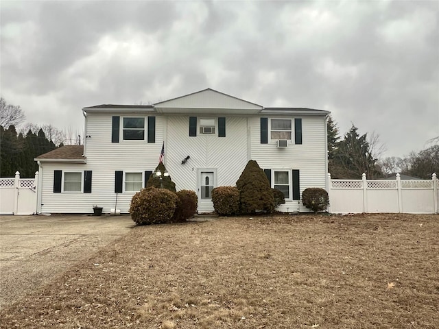 view of front of property featuring fence