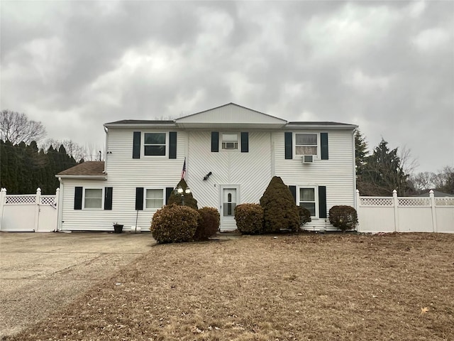 view of front of property with entry steps and fence