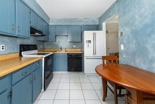 kitchen with high end white refrigerator, range with electric stovetop, blue cabinetry, dishwasher, and under cabinet range hood