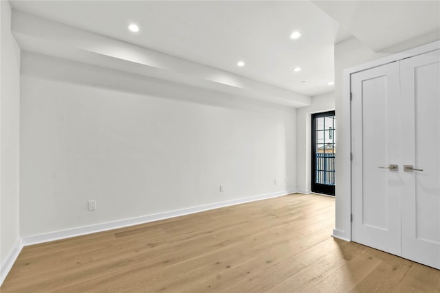 unfurnished bedroom with light wood-style floors, baseboards, and recessed lighting