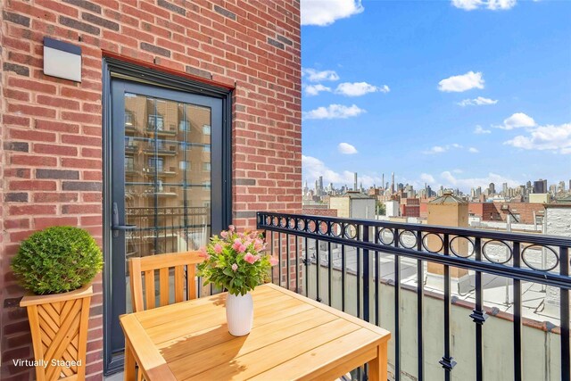 balcony featuring a city view