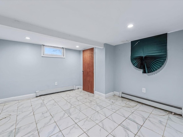 basement with recessed lighting, a baseboard radiator, and baseboards