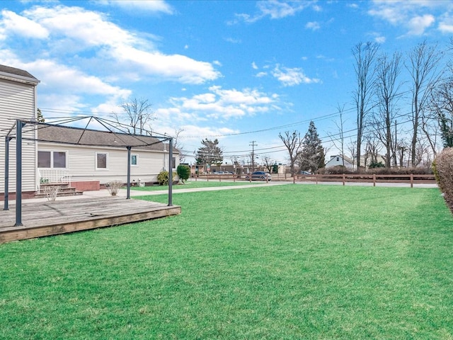 view of yard with a wooden deck