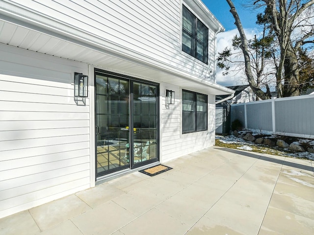 view of patio featuring fence