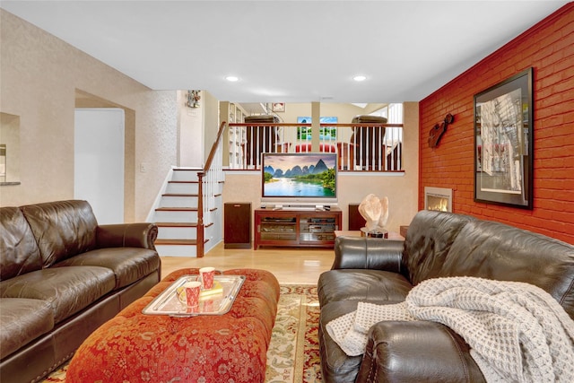 living room featuring stairway, wood finished floors, and recessed lighting