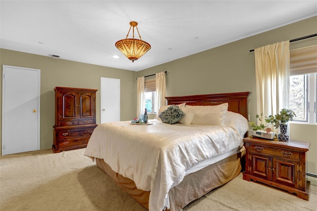 bedroom featuring a baseboard radiator, recessed lighting, and light colored carpet