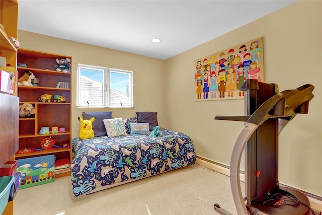 carpeted bedroom featuring a baseboard heating unit and recessed lighting