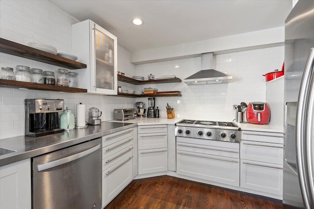 kitchen with stainless steel appliances, dark wood-style flooring, wall chimney range hood, and open shelves