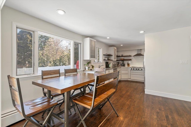 dining space featuring baseboards, dark wood-style flooring, and recessed lighting