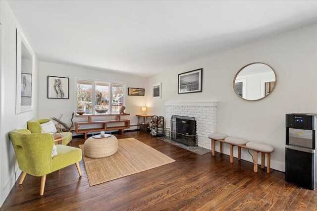 living room featuring baseboards and wood finished floors