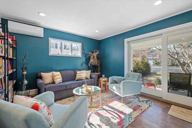 living area with recessed lighting, a wall unit AC, baseboard heating, and wood finished floors