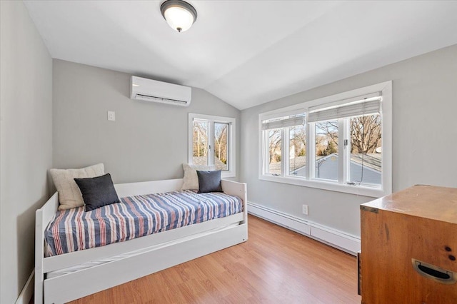 bedroom with lofted ceiling, a baseboard radiator, wood finished floors, baseboards, and a wall mounted air conditioner