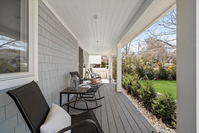 wooden deck featuring covered porch