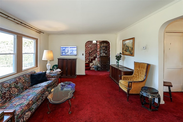 living room with arched walkways, carpet, stairs, and crown molding