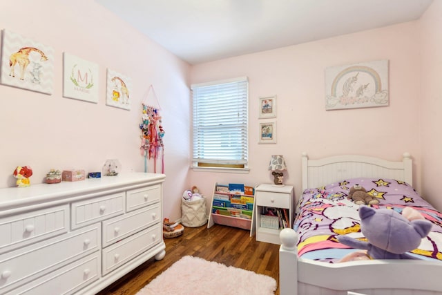 bedroom with dark wood finished floors