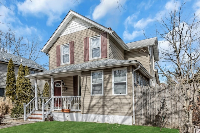 victorian home featuring a front yard and covered porch