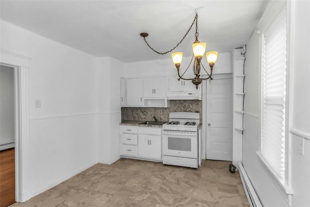 kitchen with white range with gas stovetop, a baseboard heating unit, under cabinet range hood, white cabinetry, and a notable chandelier