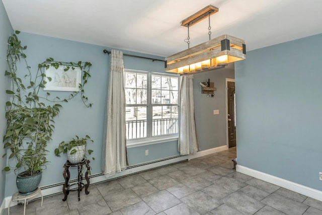 spare room featuring a baseboard radiator and baseboards