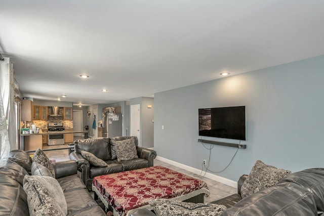 living room with recessed lighting and baseboards