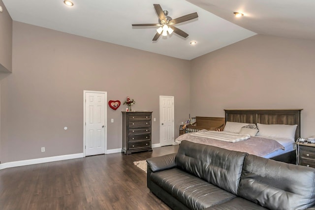 bedroom featuring dark wood-style floors, high vaulted ceiling, and baseboards