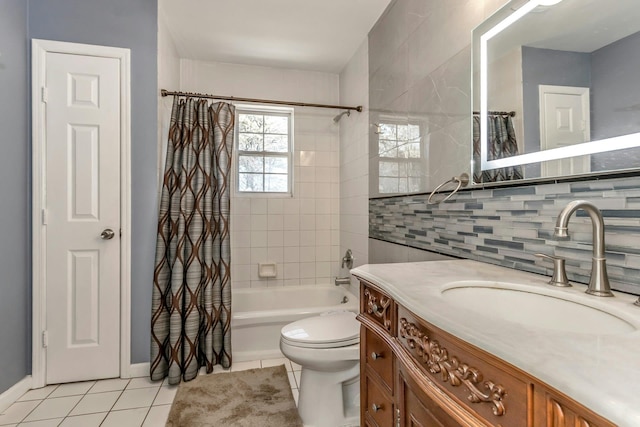 full bathroom featuring tile patterned flooring, toilet, vanity, tile walls, and shower / bath combo