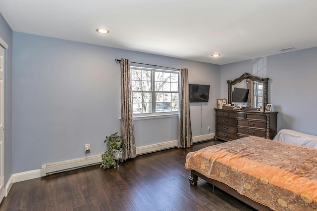 bedroom featuring recessed lighting, visible vents, baseboard heating, dark wood-type flooring, and baseboards