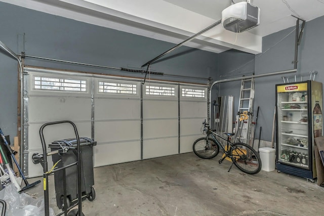 garage featuring refrigerator and a garage door opener