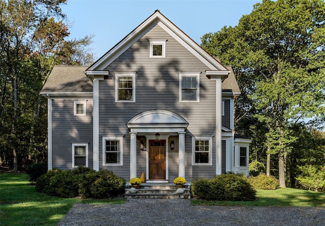 view of front of house with a shingled roof