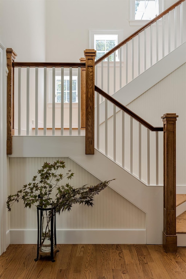 stairs featuring wood finished floors