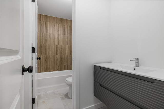 bathroom featuring  shower combination, marble finish floor, vanity, and toilet