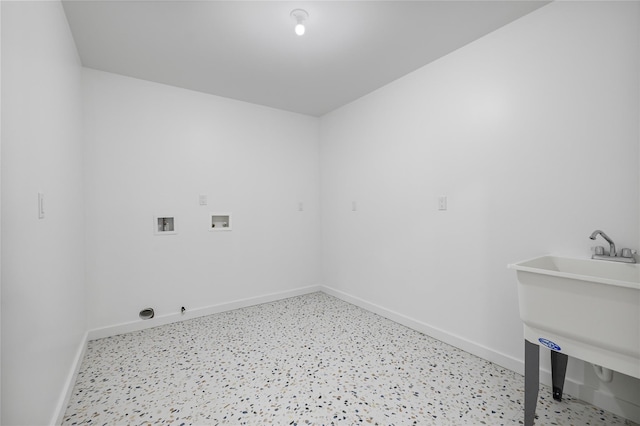 laundry room featuring a sink, laundry area, hookup for a washing machine, and baseboards