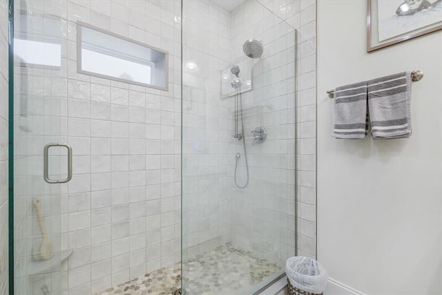 full bath featuring a shower stall