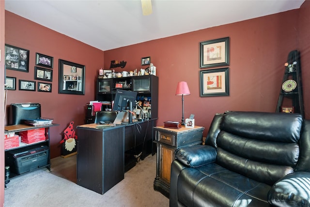 home office with carpet and a ceiling fan