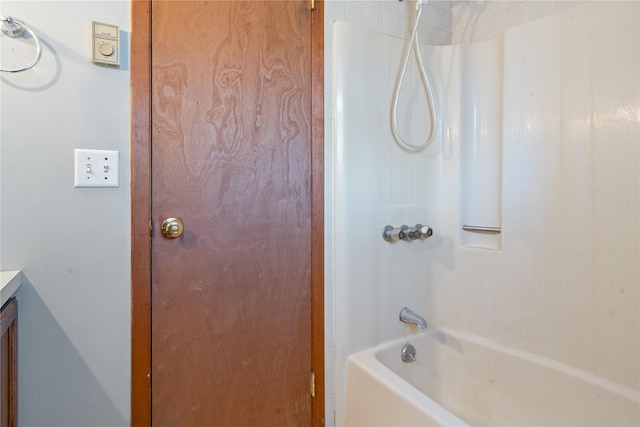 bathroom with shower / washtub combination and vanity