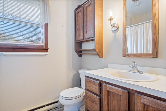 full bathroom featuring toilet, a baseboard radiator, and vanity