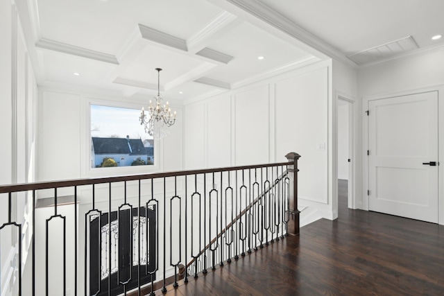 430 Wellington Rd, East Meadow, NY 11554 - corridor with dark wood-style floors, a decorative wall, ornamental molding, an upstairs landing, and coffered ceiling