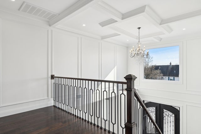 430 Wellington Rd, East Meadow, NY 11554 - corridor with dark wood-type flooring, visible vents, a decorative wall, and beam ceiling