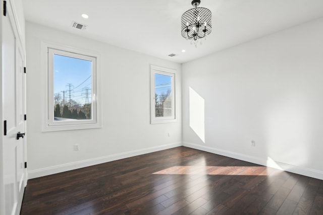 430 Wellington Rd, East Meadow, NY 11554 - spare room featuring dark wood-type flooring, recessed lighting, visible vents, and baseboards