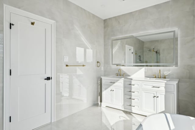 430 Wellington Rd, East Meadow, NY 11554 - full bath with tile walls, double vanity, a sink, a freestanding tub, and tiled shower
