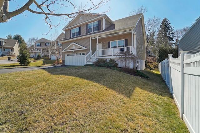 view of front of house with a porch, driveway, a front lawn, and fence