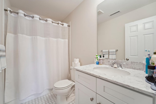 bathroom with tile patterned floors, visible vents, toilet, and vanity