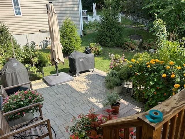 view of patio / terrace featuring area for grilling and fence